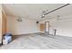 Spacious two-car garage with neutral walls, concrete floor, and ample storage space at 1826 Spruce Dr, Carmel, IN 46033