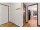 Hallway featuring hardwood floors and doorways leading to various rooms at 1826 Spruce Dr, Carmel, IN 46033