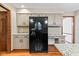Modern kitchen featuring stainless steel appliances, granite countertops, and updated cabinets at 1826 Spruce Dr, Carmel, IN 46033