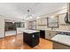 Open kitchen featuring granite countertops, stainless appliances, and access to the dining area at 1826 Spruce Dr, Carmel, IN 46033
