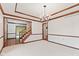 Comfortable living room with stairway, and view to other living areas at 1826 Spruce Dr, Carmel, IN 46033