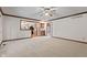 Open living room with hardwood floors and clear view into the kitchen at 1826 Spruce Dr, Carmel, IN 46033