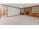 Spacious living room boasts fireplace with built-in shelves and an open doorway at 1826 Spruce Dr, Carmel, IN 46033