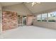 Spacious sunroom featuring brick wall and multiple windows with natural light at 1826 Spruce Dr, Carmel, IN 46033
