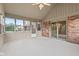 All-seasons sunroom with vaulted ceilings, brick accents, and many windows at 1826 Spruce Dr, Carmel, IN 46033