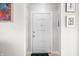 Bright entryway with a white door, framed artwork, and a sleek, minimalist design at 188 Maple Ln, Franklin, IN 46131