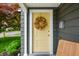 Charming home featuring a decorative wreath and a yellow painted front door at 188 Maple Ln, Franklin, IN 46131