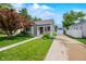 Charming single-story home with well-manicured lawn, landscaped garden, and a detached garage at 188 Maple Ln, Franklin, IN 46131
