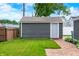 Detached garage with a brick pathway and a well-maintained lawn, offering extra storage at 188 Maple Ln, Franklin, IN 46131