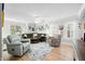 Bright and spacious living room with stylish furniture, a ceiling fan, and ample natural light at 188 Maple Ln, Franklin, IN 46131
