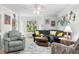 Comfortable living room with a sectional sofa, accent chairs, and a ceiling fan at 188 Maple Ln, Franklin, IN 46131