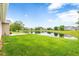 Expansive backyard with lush green lawn and serene pond views, perfect for outdoor relaxation and enjoyment at 18991 Round Lake Rd, Noblesville, IN 46060