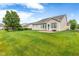Large backyard features a patio and a well-maintained lawn perfect for outdoor activities and gatherings at 18991 Round Lake Rd, Noblesville, IN 46060