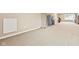 Large carpeted basement with neutral walls, plenty of space, and natural light at 18991 Round Lake Rd, Noblesville, IN 46060