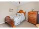 Cozy bedroom with wooden furniture and soft carpet at 18991 Round Lake Rd, Noblesville, IN 46060