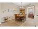 An open-concept dining area with neutral carpet and ample space for entertaining at 18991 Round Lake Rd, Noblesville, IN 46060