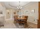 Formal dining room with a round table, chandelier and light colored walls at 18991 Round Lake Rd, Noblesville, IN 46060