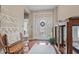 A welcoming foyer features a bench, unique accents, and natural lighting at 18991 Round Lake Rd, Noblesville, IN 46060