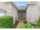 Close up of a home's entrance, showcasing the brick facade and well-kept landscaping at 18991 Round Lake Rd, Noblesville, IN 46060