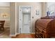 Hallway view of a laundry room with a door leading to another room at 18991 Round Lake Rd, Noblesville, IN 46060