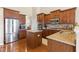 Kitchen features modern stainless-steel appliances, an island, granite countertops, and ample cabinet space at 18991 Round Lake Rd, Noblesville, IN 46060