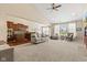 Open-concept living room featuring a kitchen with wood cabinets at 18991 Round Lake Rd, Noblesville, IN 46060