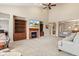 Open-concept living room featuring a fireplace, TV, and carpeted floors at 18991 Round Lake Rd, Noblesville, IN 46060