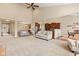 Large living room with an open layout, carpeted floors, and a view of the kitchen at 18991 Round Lake Rd, Noblesville, IN 46060