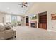 Living room with a fireplace, built-in bookshelves, and carpeted floors at 18991 Round Lake Rd, Noblesville, IN 46060