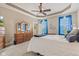 Inviting main bedroom features a queen bed, dresser, and a view of the exterior at 18991 Round Lake Rd, Noblesville, IN 46060