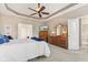 Spacious main bedroom features a large bed, tray ceiling, and wood furniture at 18991 Round Lake Rd, Noblesville, IN 46060