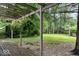 Wooden deck with plants under a pergola overlooking a spacious backyard at 20417 State Road 37 N, Noblesville, IN 46060