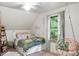 Bedroom featuring a comfortable bed, hanging chair, and natural light, creating a relaxing and inviting atmosphere at 20417 State Road 37 N, Noblesville, IN 46060