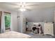 Bedroom with neutral colors features a charming vanity, closet nook, and window for natural light, creating a relaxing atmosphere at 20417 State Road 37 N, Noblesville, IN 46060