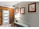 Inviting entryway featuring a stylish console table and a view of the front door with sidelights and wooden staircase at 20417 State Road 37 N, Noblesville, IN 46060