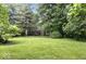 Expansive front yard with mature trees, offering a serene and private setting for the home at 20417 State Road 37 N, Noblesville, IN 46060