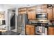 Functional kitchen with stainless steel appliances and wood cabinets, offering modern convenience at 20417 State Road 37 N, Noblesville, IN 46060