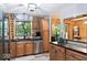 Well-equipped kitchen with stainless steel appliances, wood cabinets, and an eat-in counter at 20417 State Road 37 N, Noblesville, IN 46060