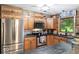Efficient kitchen featuring stainless steel appliances and wood cabinets, providing a modern look at 20417 State Road 37 N, Noblesville, IN 46060