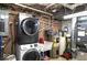 Laundry room with a washer and dryer, utility sink, and water heater in basement at 20417 State Road 37 N, Noblesville, IN 46060