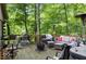 Outdoor living space with comfortable seating, a fire pit, and a grill, perfect for entertaining at 20417 State Road 37 N, Noblesville, IN 46060