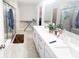 Bathroom featuring a double vanity with quartz countertops and modern fixtures at 2358 S Stonehill Way, New Palestine, IN 46163