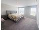 This spacious bedroom is enhanced by plush carpet and great natural light at 2358 S Stonehill Way, New Palestine, IN 46163