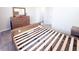 Bedroom with neutral walls and soft carpet at 2358 S Stonehill Way, New Palestine, IN 46163