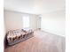 Bedroom with carpet, window, and a blow up bed at 2358 S Stonehill Way, New Palestine, IN 46163