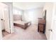 Well-lit bedroom featuring neutral walls and carpet ready for your personal touch at 2358 S Stonehill Way, New Palestine, IN 46163