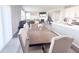 Spacious dining room featuring a large dining table with upholstered chairs and open floor plan concept at 2358 S Stonehill Way, New Palestine, IN 46163