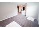 Spacious hallway with neutral carpet leading to various rooms, offering a bright and airy feel at 2358 S Stonehill Way, New Palestine, IN 46163