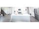 Bright kitchen features white cabinets, stainless appliances, a subway tile backsplash, and a large center island at 2358 S Stonehill Way, New Palestine, IN 46163