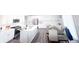 Bright eat-in kitchen featuring stainless appliances, subway tile backsplash, white cabinets, and a dining table set at 2358 S Stonehill Way, New Palestine, IN 46163